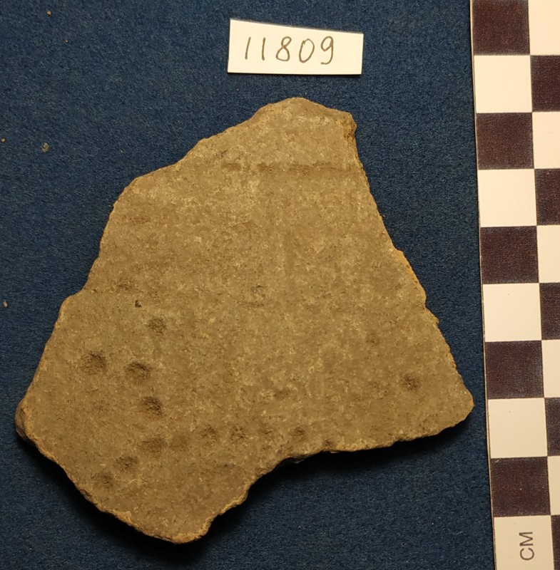 Фрагмент стінки ліпної сіроглиняної посудини