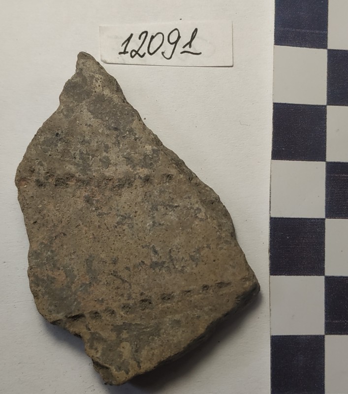 Фрагмент стінки ліпної сіроглиняної посудини