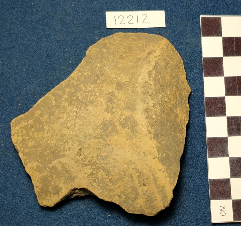 Фрагмент дна ліпної жовтоглиняної посудини