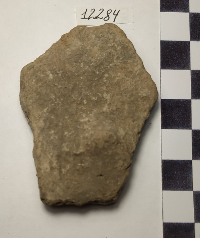 Фрагмент стінки ліпної жовтоглиняної посудини із круглим наліпом