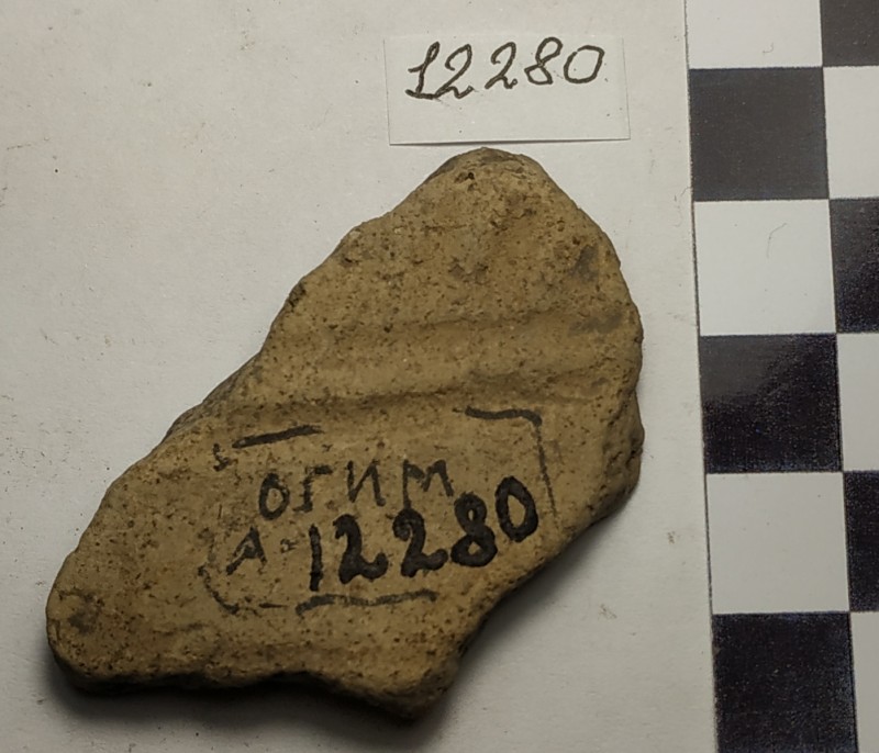 Фрагмент стінки ліпної жовтоглиняної посудини