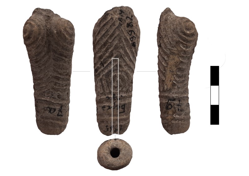 Нижня частина антропоморфної статуетки.