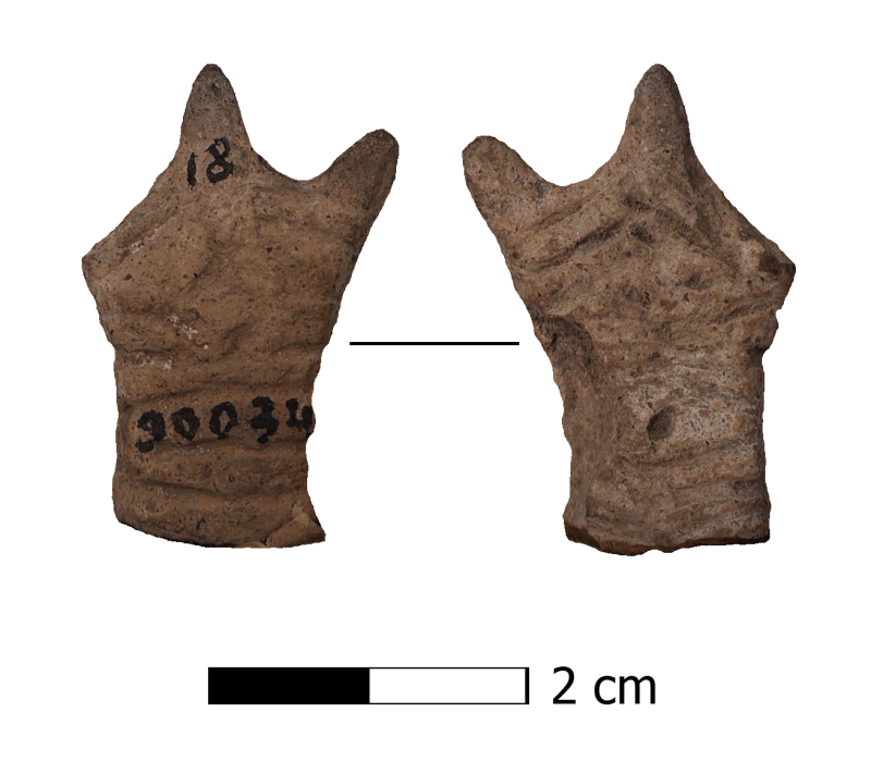 Фрагмент верхньої частини глиняної антропоморфної статуетки.